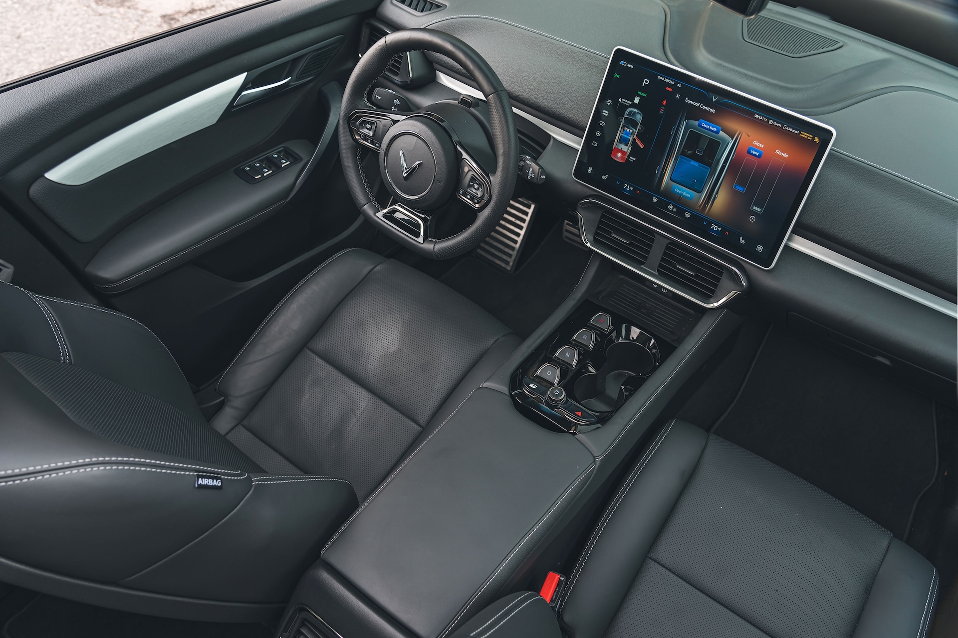 2024 VinFast VF8 Interior view of front seats, dash, infotainment, and steering wheel
