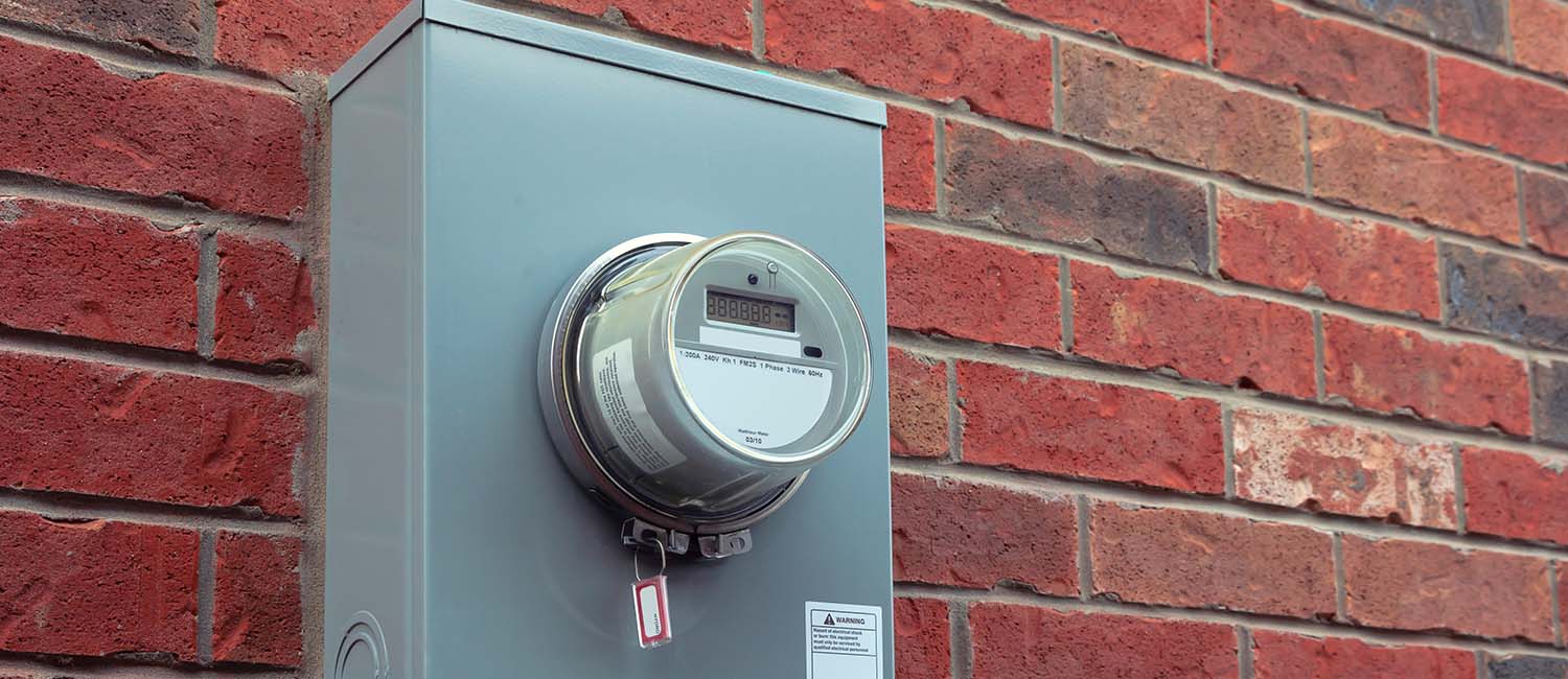 Electricity hydro power electric energy smart meter on the brick wall