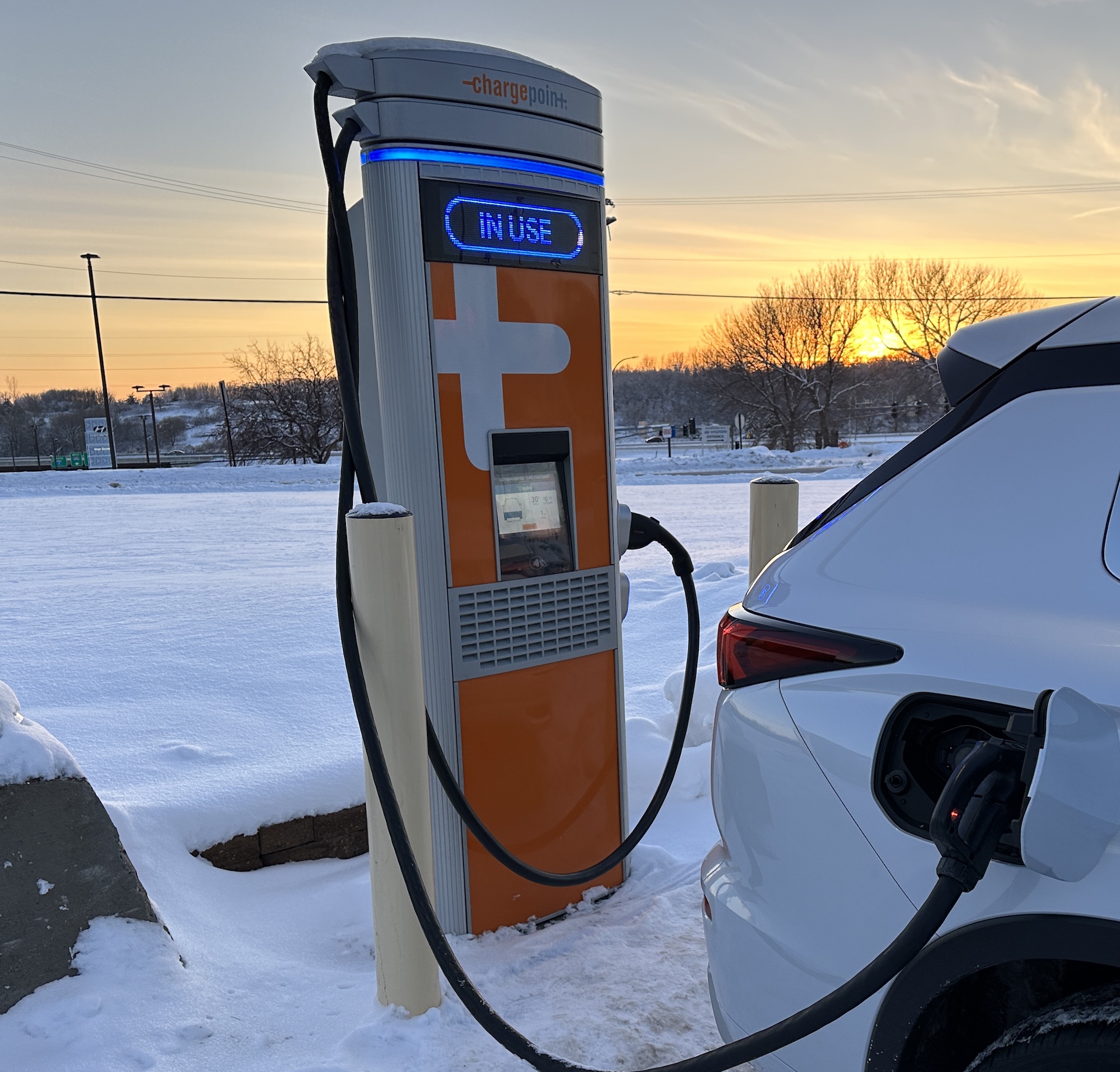 EV being charged in the winter with snow on the ground