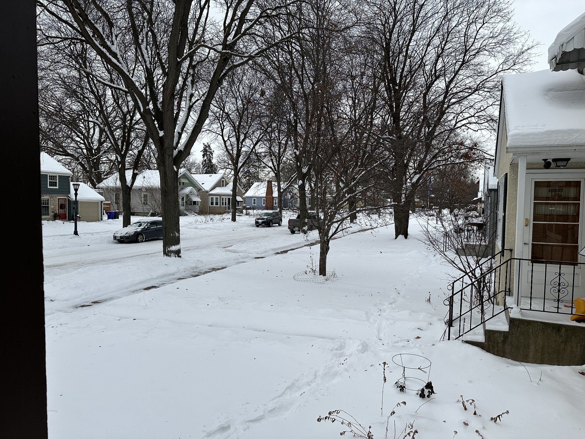 Snow covered neighborhood street before the plow