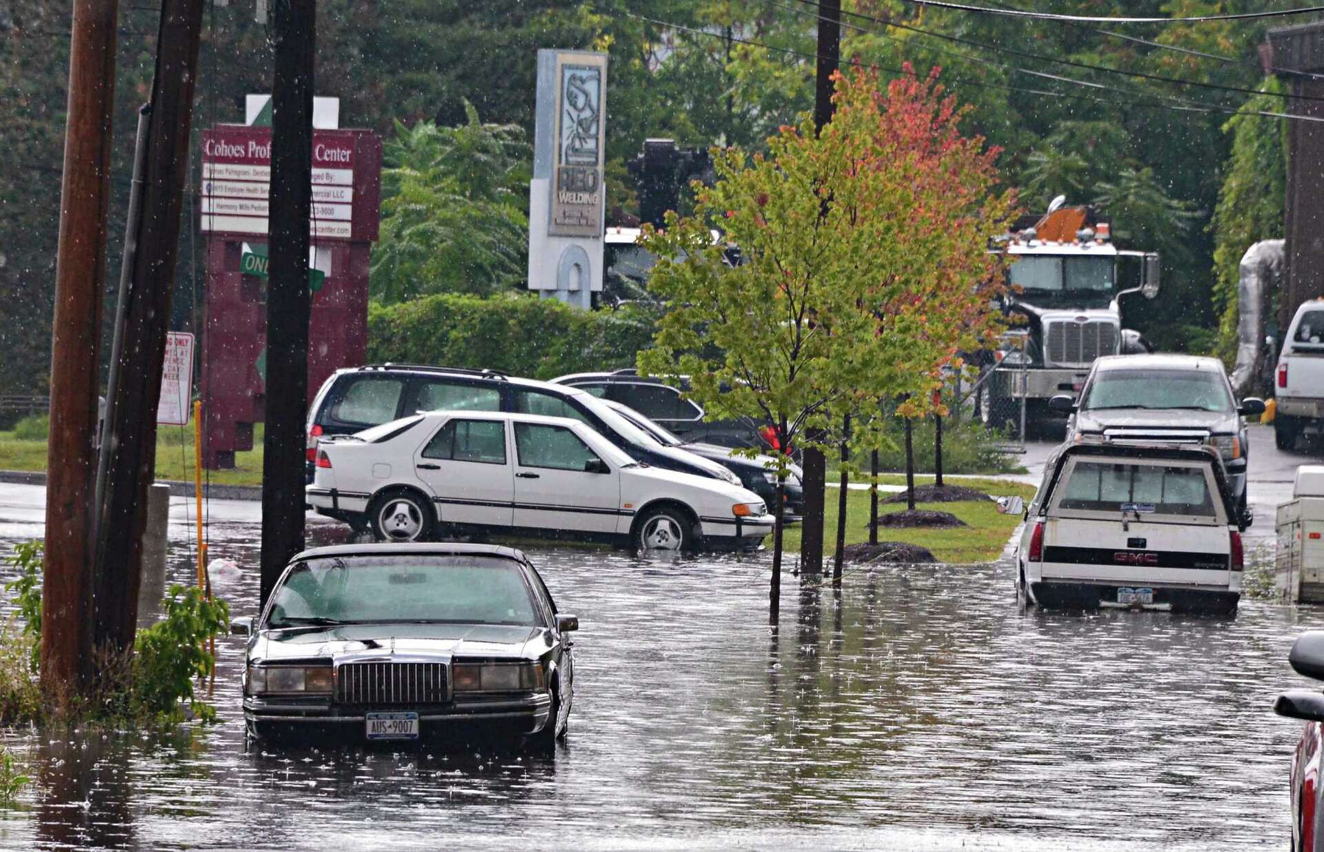 Cars in inches of water on the street