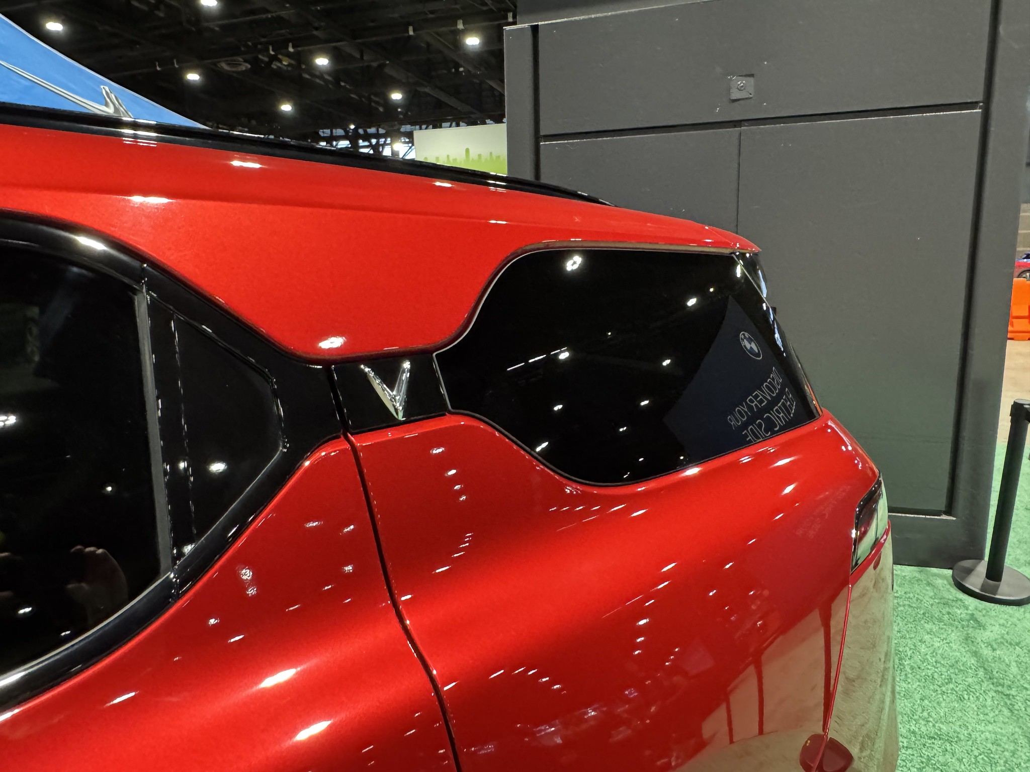 VinFast VF7 Red parked in a showroom